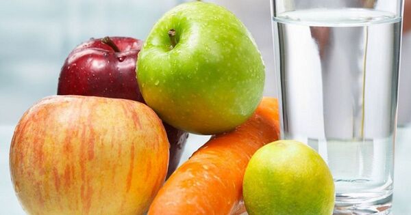 Calm kitchen scene with fruit and a glass of water